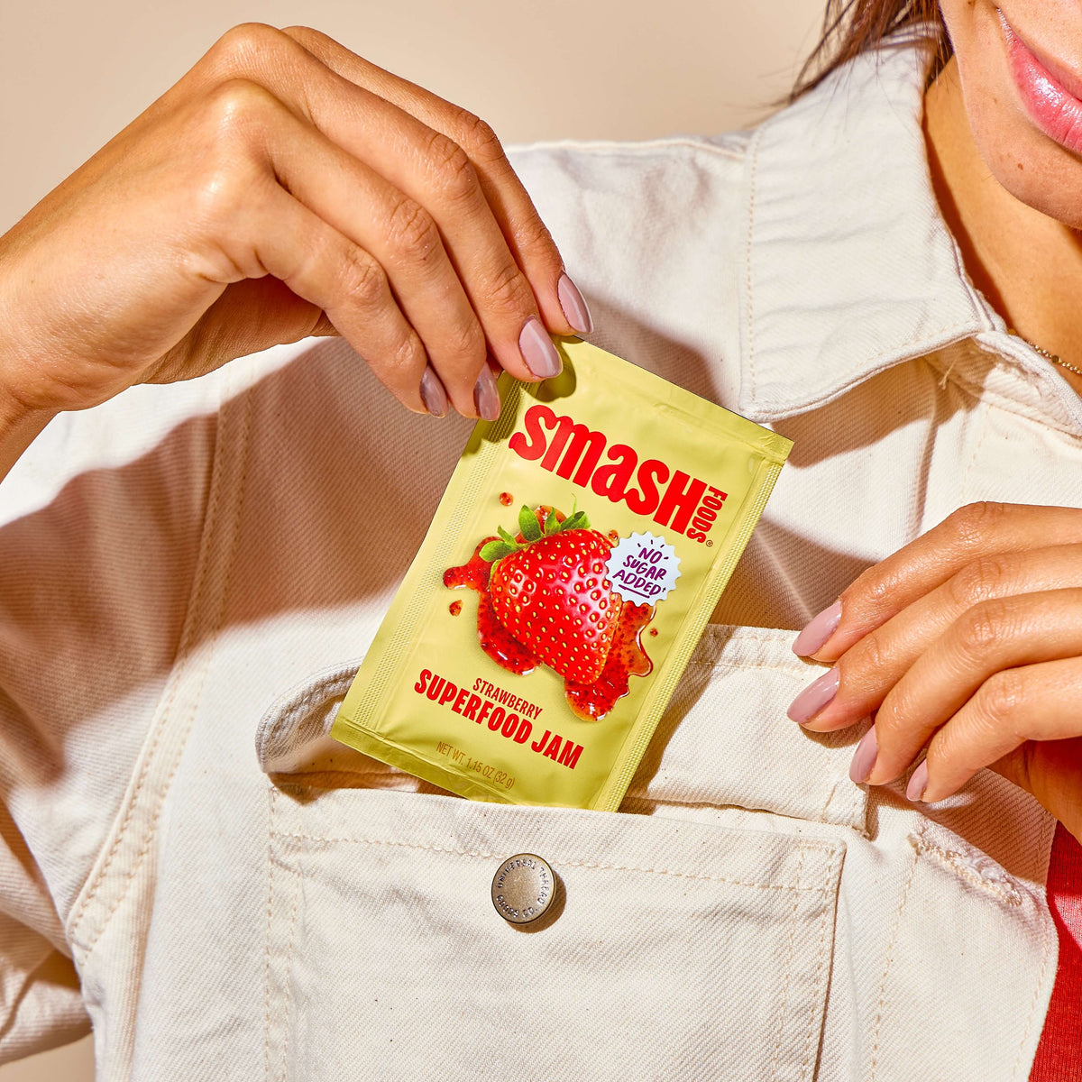 Strawberry squeeze packet pulled from a jacket pocket